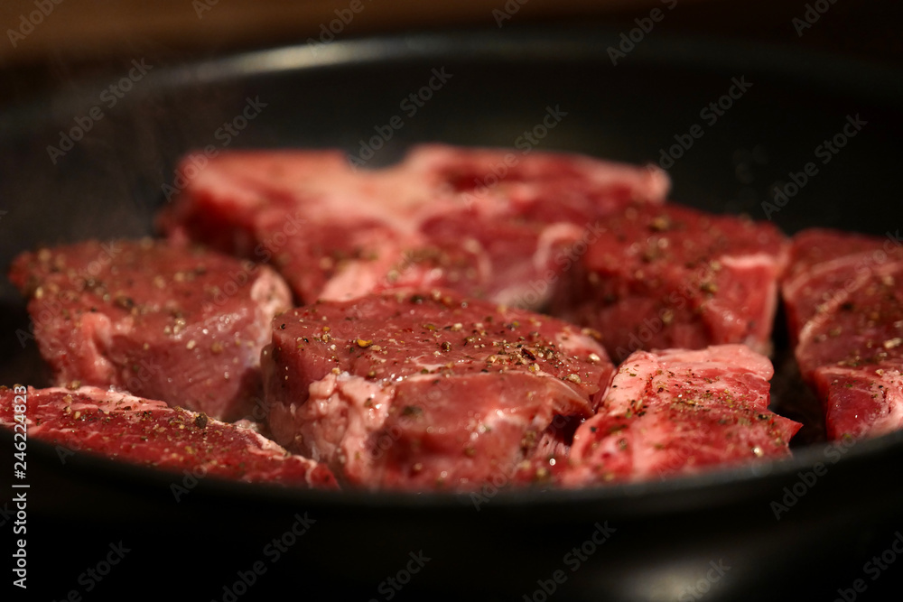 Fresh meat in frying pan Fresh meat in frying pan