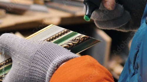 A man works in a framing studio. photo