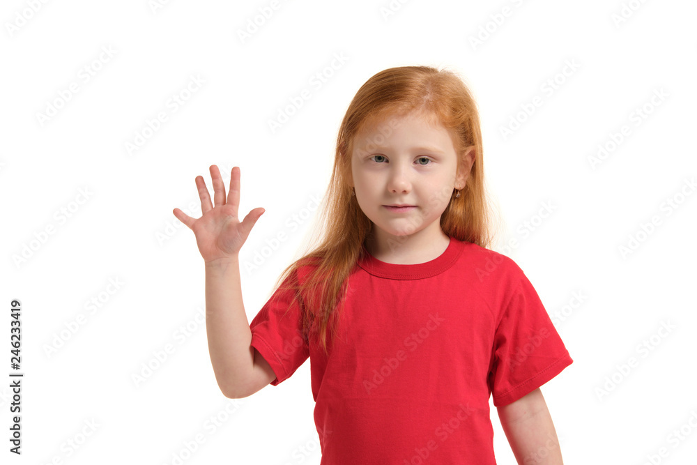 A little girl shows gesture - five fingers, isolated on white background A little girl shows gesture - five fingers, isolated on white background