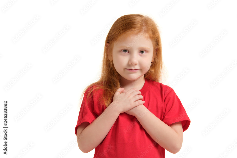 Portrait of cheerful caucasian little girl with red hair posing in studio with looking to the camera. Portrait of cheerful caucasian little girl with red hair posing in studio with looking to the camera.