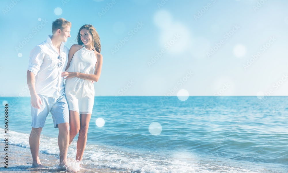 Beach couple walking on romantic travel honeymoon vacation Beach couple walking on romantic travel honeymoon vacation