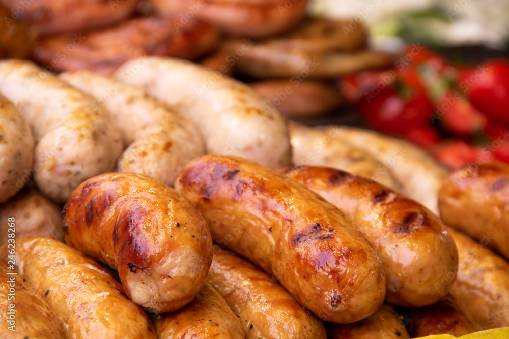 Grilled Bavarian sausages with vegetables on street food fastivale Grilled Bavarian sausages with vegetables on street food fastivale