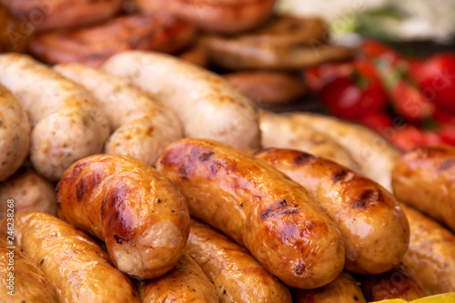 Grilled Bavarian sausages with vegetables on street food fastivale