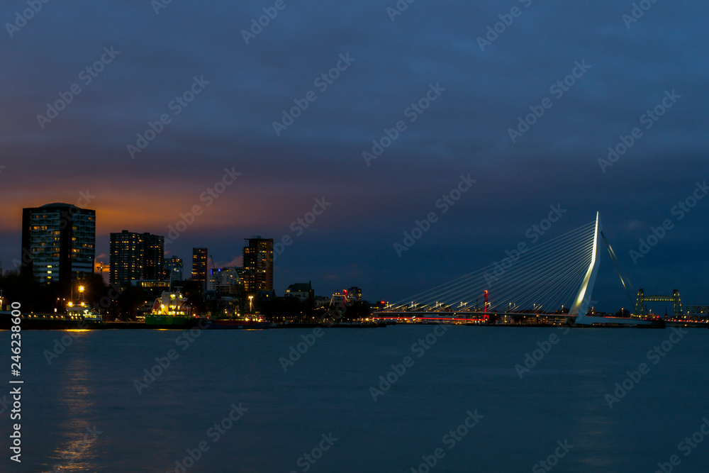Beautiful view of the city center of Rotterdam. Erasmus bridge over the river Meuse. Rotterdam city center in the evening. ROTTERDAM, HOLLAND.