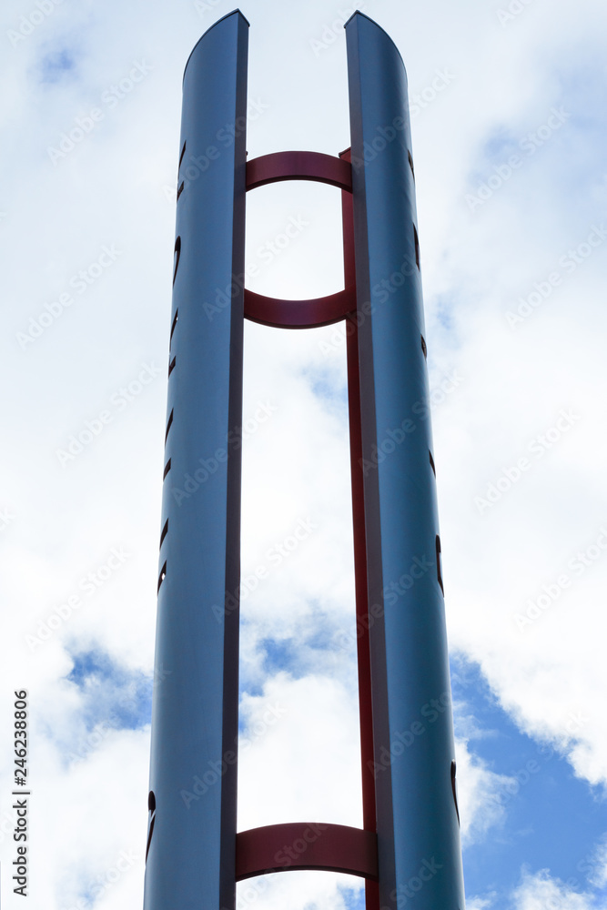 Blue and red abstract steel construction against the background of the blue sky. Blue and red abstract steel construction against the background of the blue sky.