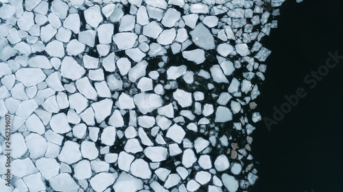 Bright ice texture broken into pieces of different shapes and sizes	