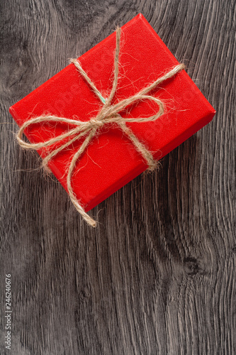 Red gift boxes tied with vintage ribbons on wooden dark background. Gift, present for Valentine's Day, 14 february . copy paste space.
