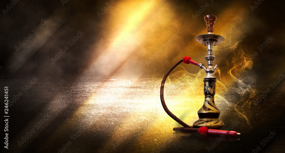 Hookah smoking on a background of abstract futuristic background, neon light, smoke.