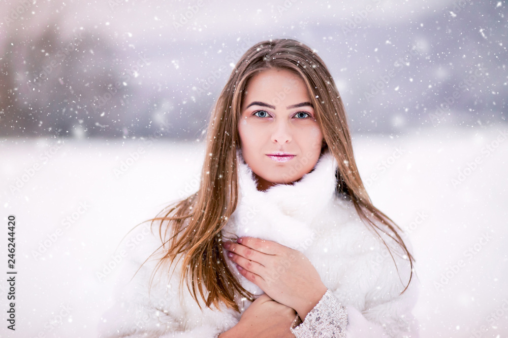 Besutiful woman portrait in the snow Besutiful woman portrait in the snow