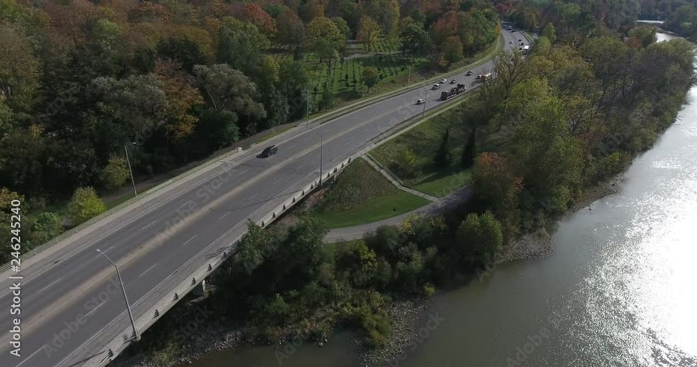 High Angle View Of River And Bridge With Traffic Panorama Then Bird Flies By High Angle View Of River And Bridge With Traffic Panorama Then Bird Flies By
