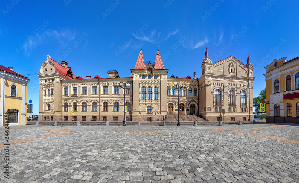 Rybinsk, Russia. Red square and exterior of historic building - former grain exchange in russian revival style
