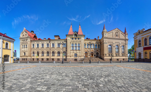 Rybinsk, Russia. Red square and exterior of historic building - former grain exchange in russian revival style