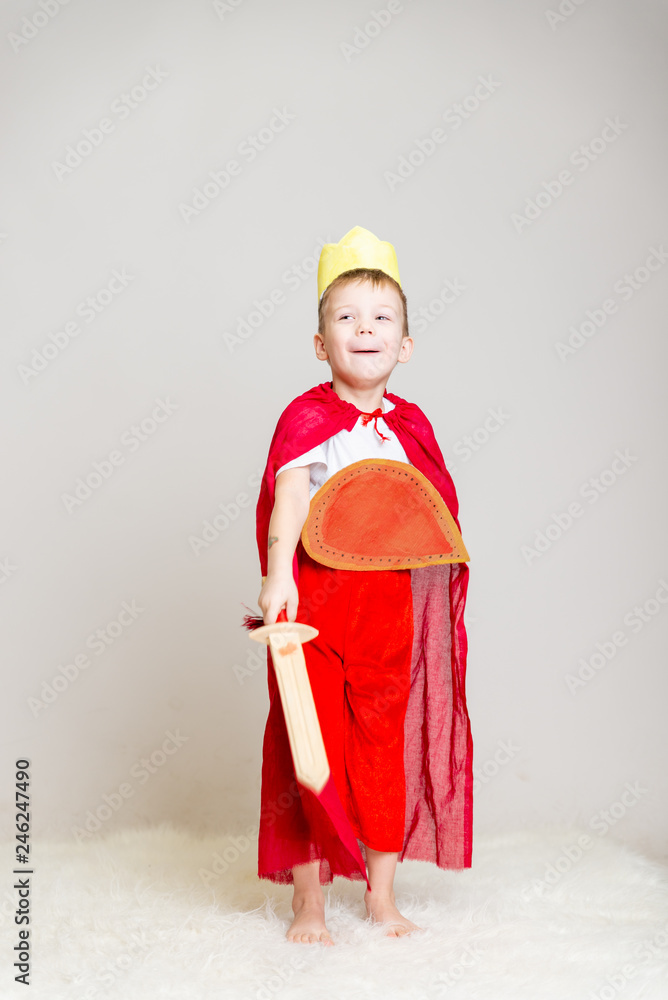 child in knight costume with crown