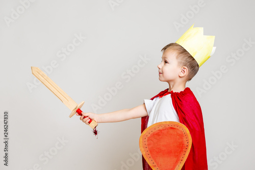 child in knight costume with crown