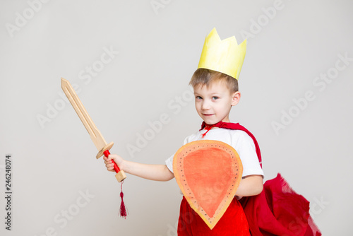 child in knight costume with crown
