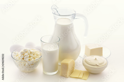 Dairy products on white background. Milk, cottage cheese, sour cream, cheese, butter, eggs, still life from healthy dairy products. Dairy nutrition is good for children's health.