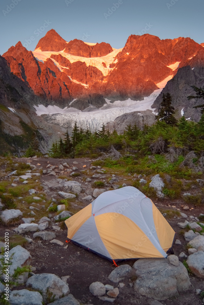 Tent Camping at Lake Ann and Curtis Glacier at the Foot of the Imposing Mount Shuksan. Lower Curtis Glacier is in North Cascades National Park. The glacier is on the western slopes of Mount Shuksan.