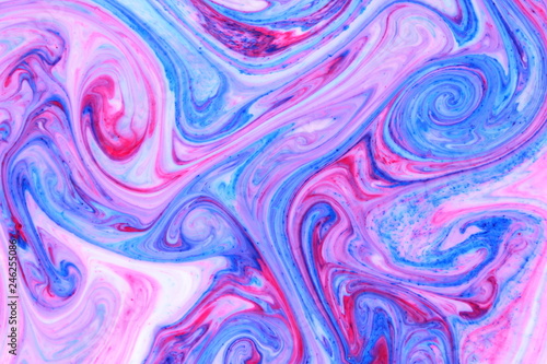Abstract multicolored background. Fluid art of pink blue. Blue pink texture. Colored paint stains in liquid