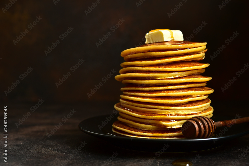 Homemade pancakes with honey or maple syrup. Homemade pancakes with honey or maple syrup.