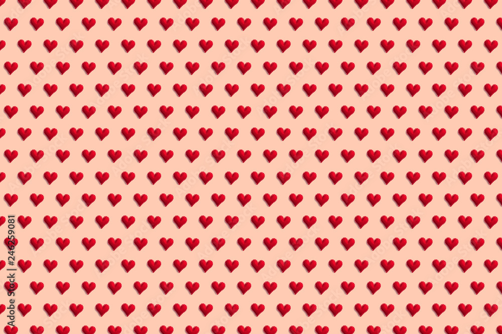 Red hearts on a colored pastel background. Pattern for the design of textiles and wallpaper. Concept of sv. Valentine's and women's day. Red hearts on a colored pastel background. Pattern for the design of textiles and wallpaper. Concept of sv. Valentine's and women's day.