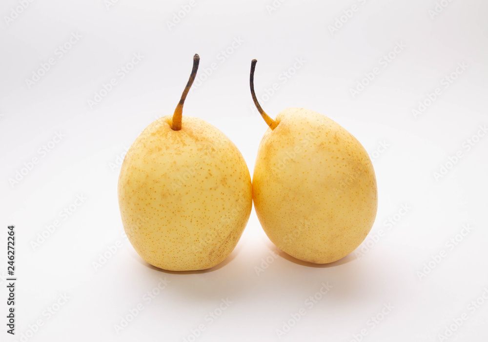 two yellow pears on a light background two yellow pears on a light background