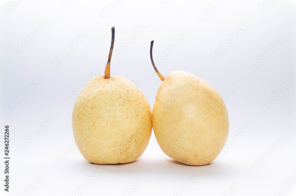 two yellow pears on a light blue and white background two yellow pears on a light blue and white background