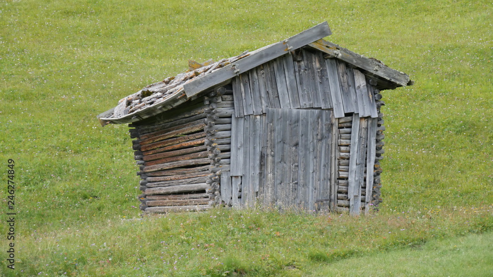 Hunting hut in nature with cloudy sky Hunting hut in nature with cloudy sky
