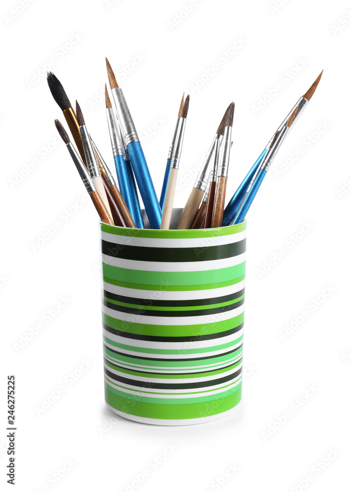 Holder with different paint brushes on white background Holder with different paint brushes on white background