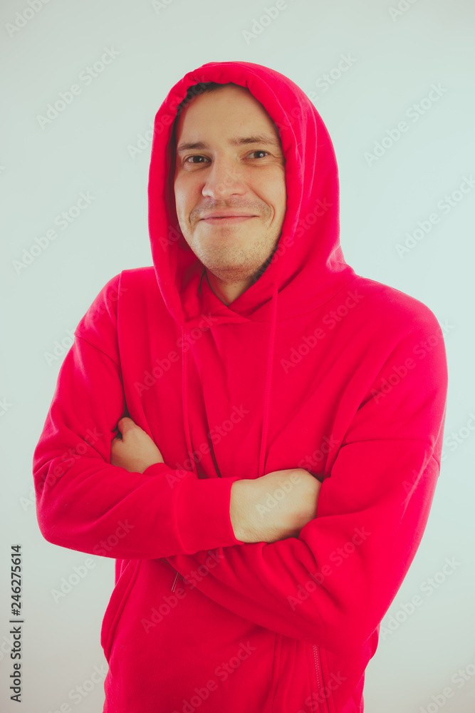 Crazy and charismatic guy posing. A man in a red tracksuit. Man isolated on white background, space for text Crazy and charismatic guy posing. A man in a red tracksuit. Man isolated on white background, space for text