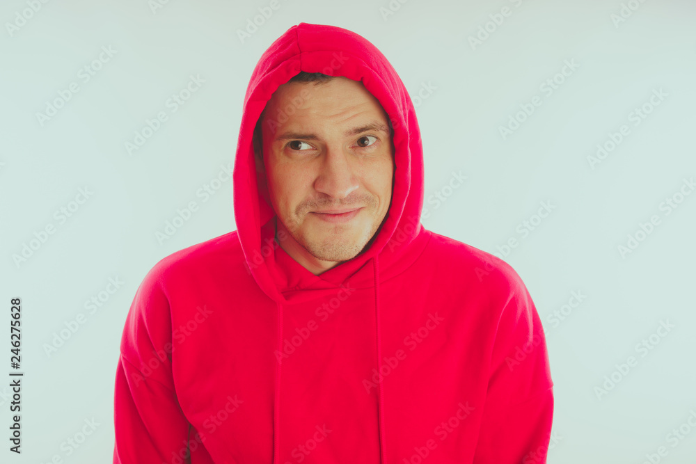 Crazy and charismatic guy posing. A man in a red tracksuit. Man isolated on white background, space for text Crazy and charismatic guy posing. A man in a red tracksuit. Man isolated on white background, space for text