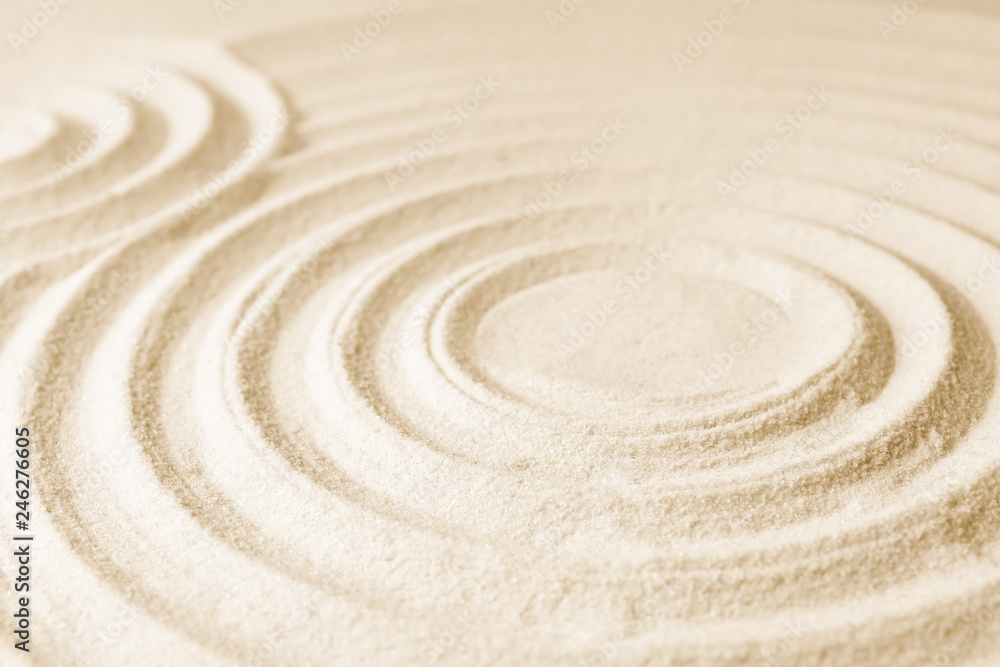 Fototapeta Zen garden pattern on sand. Meditation and harmony