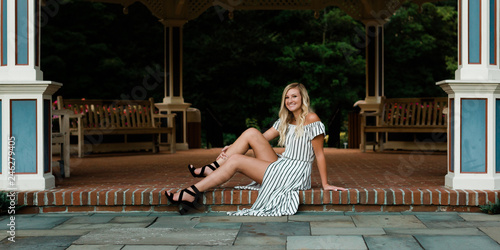 High School Senior Photo of Blonde Caucasian Girl Outdoors in Romper Dress