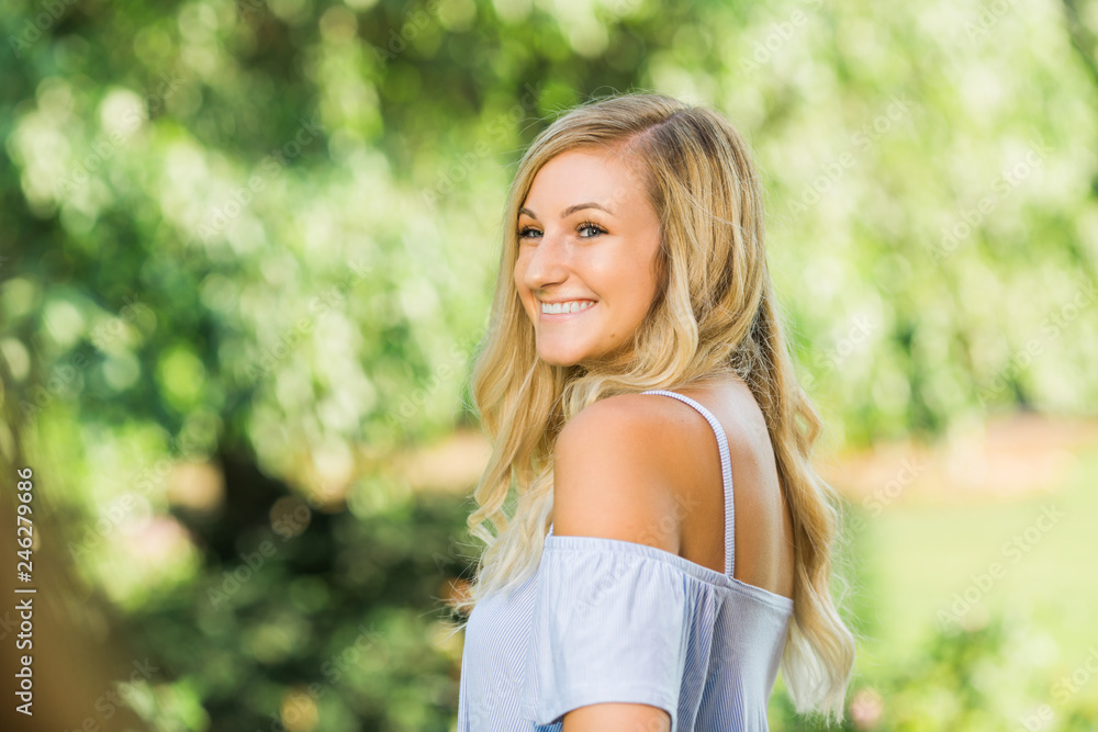 High School Senior Photo of Blonde Caucasian Girl Outdoors High School Senior Photo of Blonde Caucasian Girl Outdoors