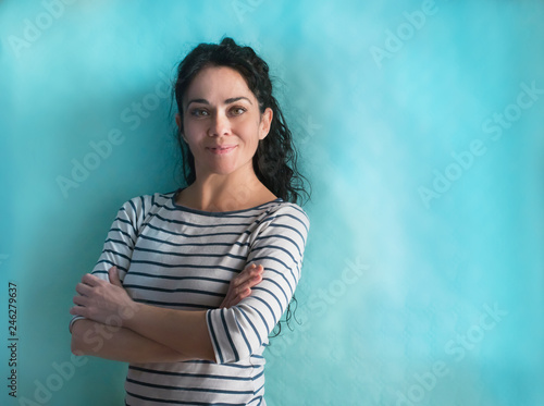 brunette business woman over isolated background smiling looking to the camera