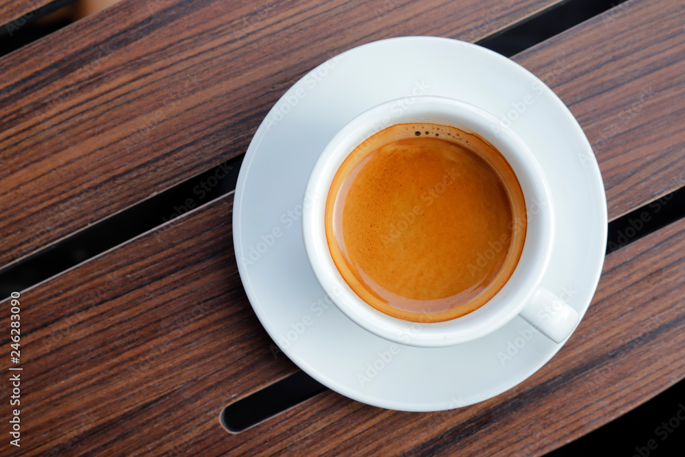 Obraz premium Hot coffee on wood background.