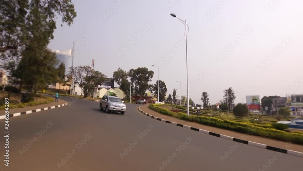 Traffic circle, roundabout, cars, motorbikes, motorcycles driving on a ...