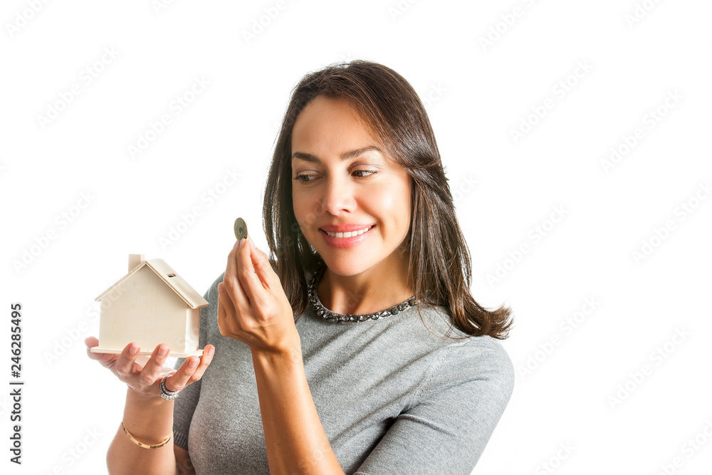 Young beautiful woman saving for a new house isolated on white background Young beautiful woman saving for a new house isolated on white background