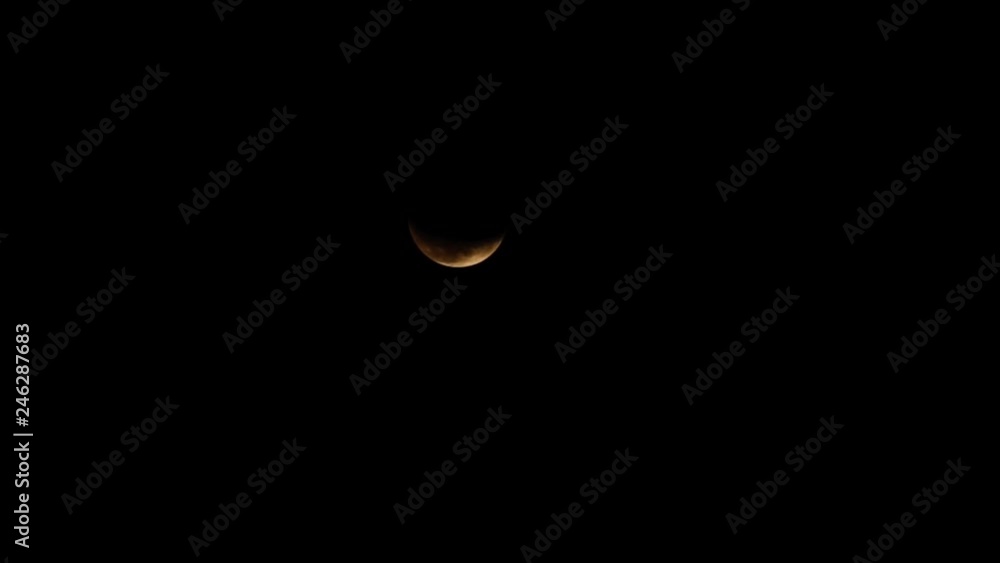 The crescent moon in the night while the clouds moving across it The crescent moon in the night while the clouds moving across it
