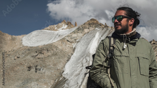 Portrait of Mixed race man traveler in mountains