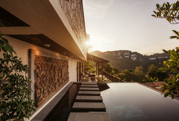 Private swimming pool near luxury villa. Sunny summer vacation