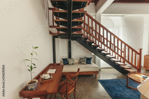 Interior design in luxury hotel with stairs on second floor photo