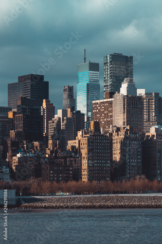 Cityscape of Midtown East Manhattan buildings in dramatic light