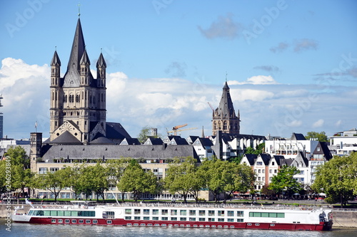 Great St. Martin Church and colorful houses  in Cologne, Germany,2017 photo