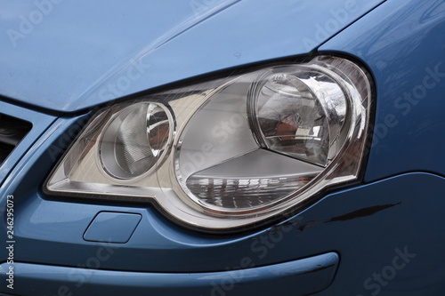 shiny headlight on a white car