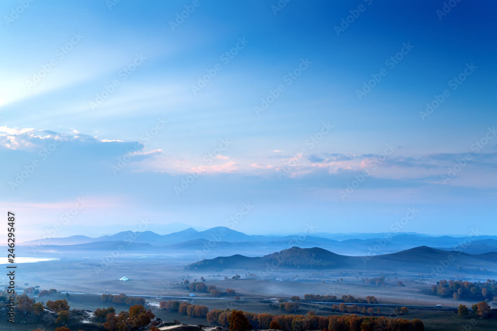 Early morning grassland and mountains