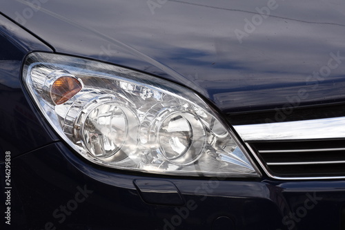 shiny headlight on a white car