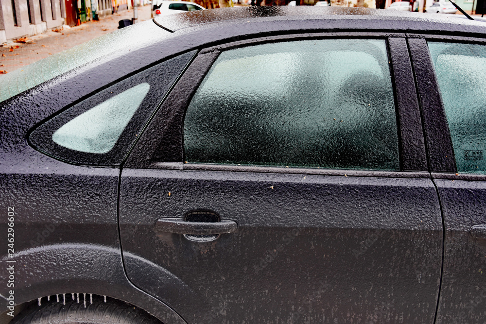  Frozen car headlight,Freezing rain ice coated car. 