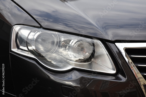 Car'sCar exterior detail.shiny headlight on a black  car exterior detail, headlight on a  new car © Laurenx