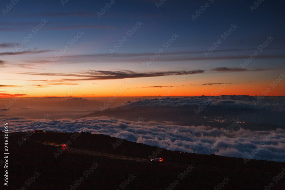 Haleakala Crater at dusk: Haleakala Highway, View of Maui and City lights of Kahului 
