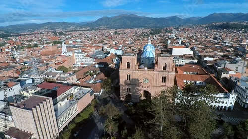 Aerial shots showing off the beautiful catholic churches and unique colonial architecture of Cuenca, Ecuador. photo